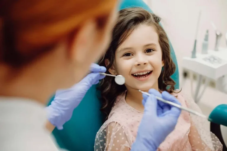 A happy young girl in a dental chair